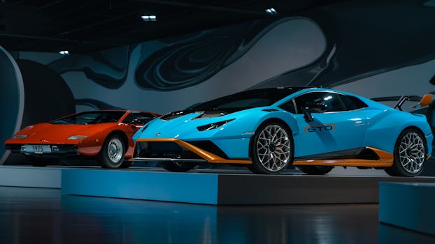 Exquisite collection of vintage and modern luxury cars showcased indoors.